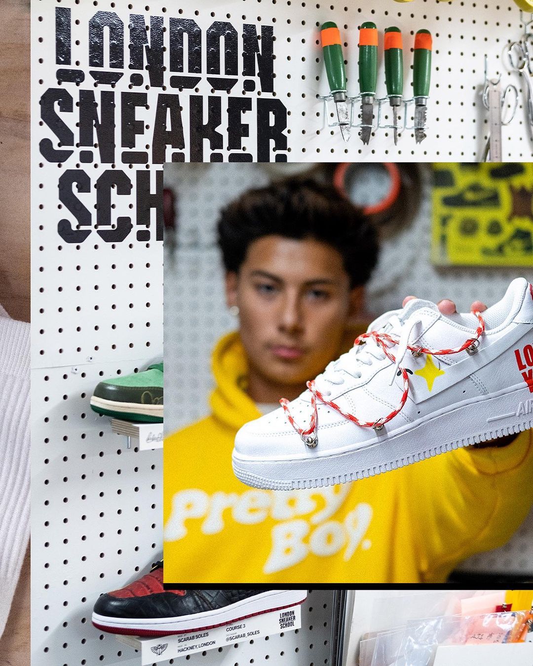 Man holds up custom London Sneaker School Sneaker