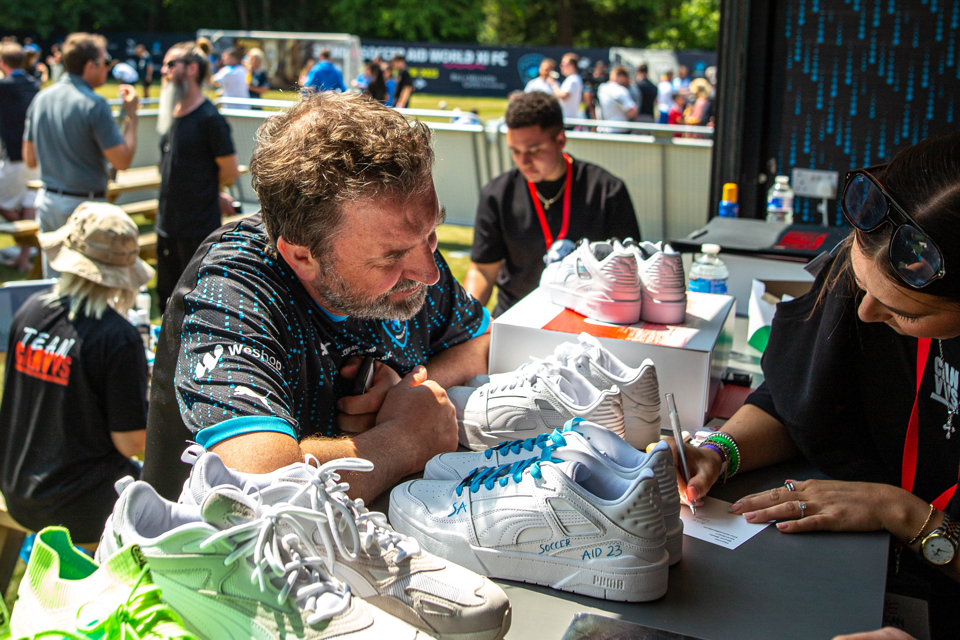 Comdian Lee Mack Choosing his Soccer Aid Customised Sneakers